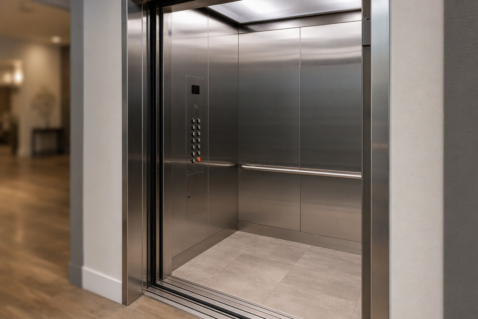 ADA-compliant elevator cab interior in a Scottsdale Arizona apartment building showing handrails, accessible control panel placement, and door threshold tactile strips per Fair Housing Act guidelines