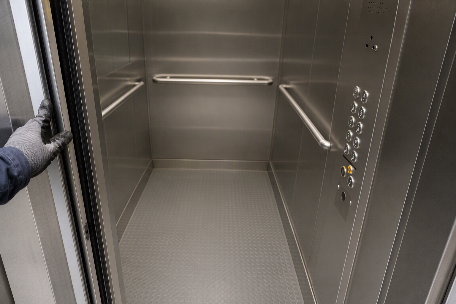 ADA-Compliant Healthcare Elevator Cab Interior Detail Close-up of an ADA-compliant hospital elevator cab interior in Arizona showing Braille control panel, grab rails, and door sensor — key elements of healthcare elevator inspection requirements.