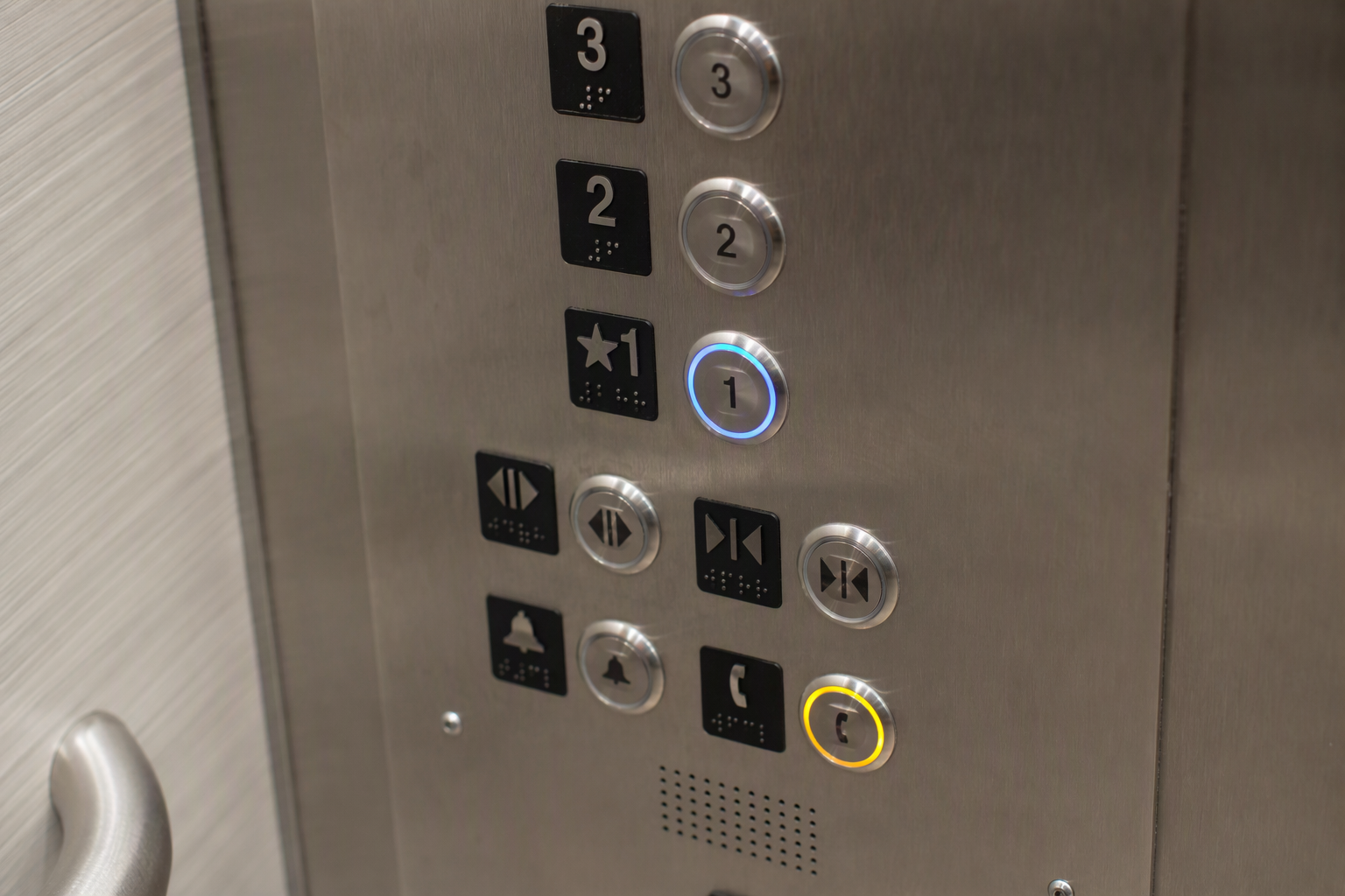ADA Elevator Control Panel with Braille — Phoenix Healthcare ADA elevator control panel inside a Phoenix hospital elevator showing Braille labels, raised buttons, and accessible two-way emergency communication fixture